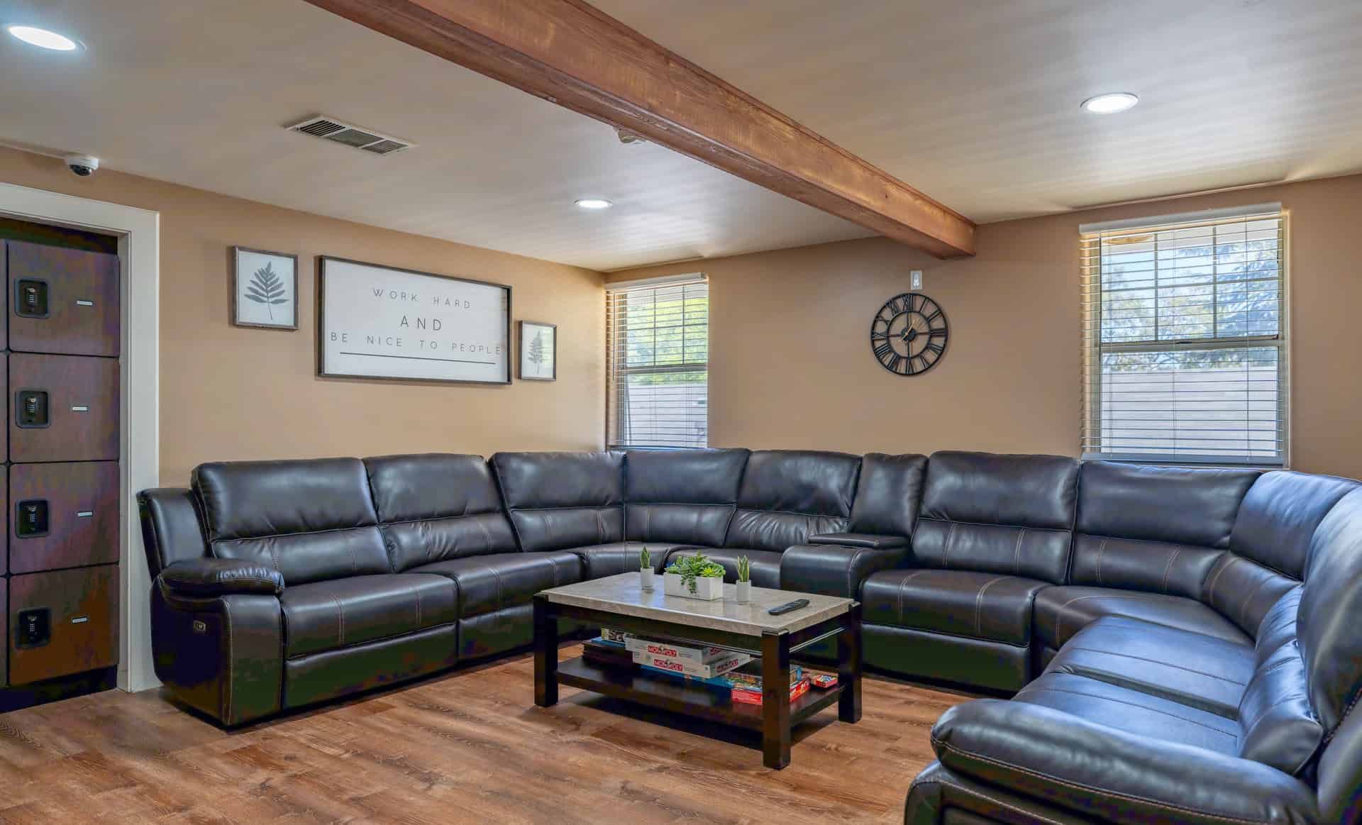 Living room with a large leather sofa.