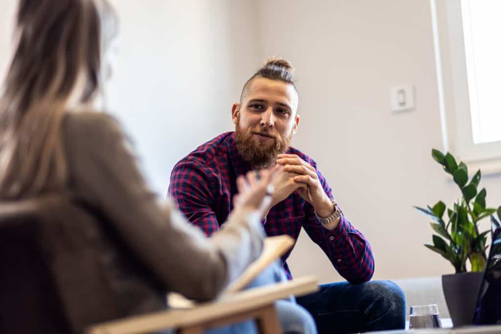 A man enjoys an individual treatment session during intensive outpatient program in California