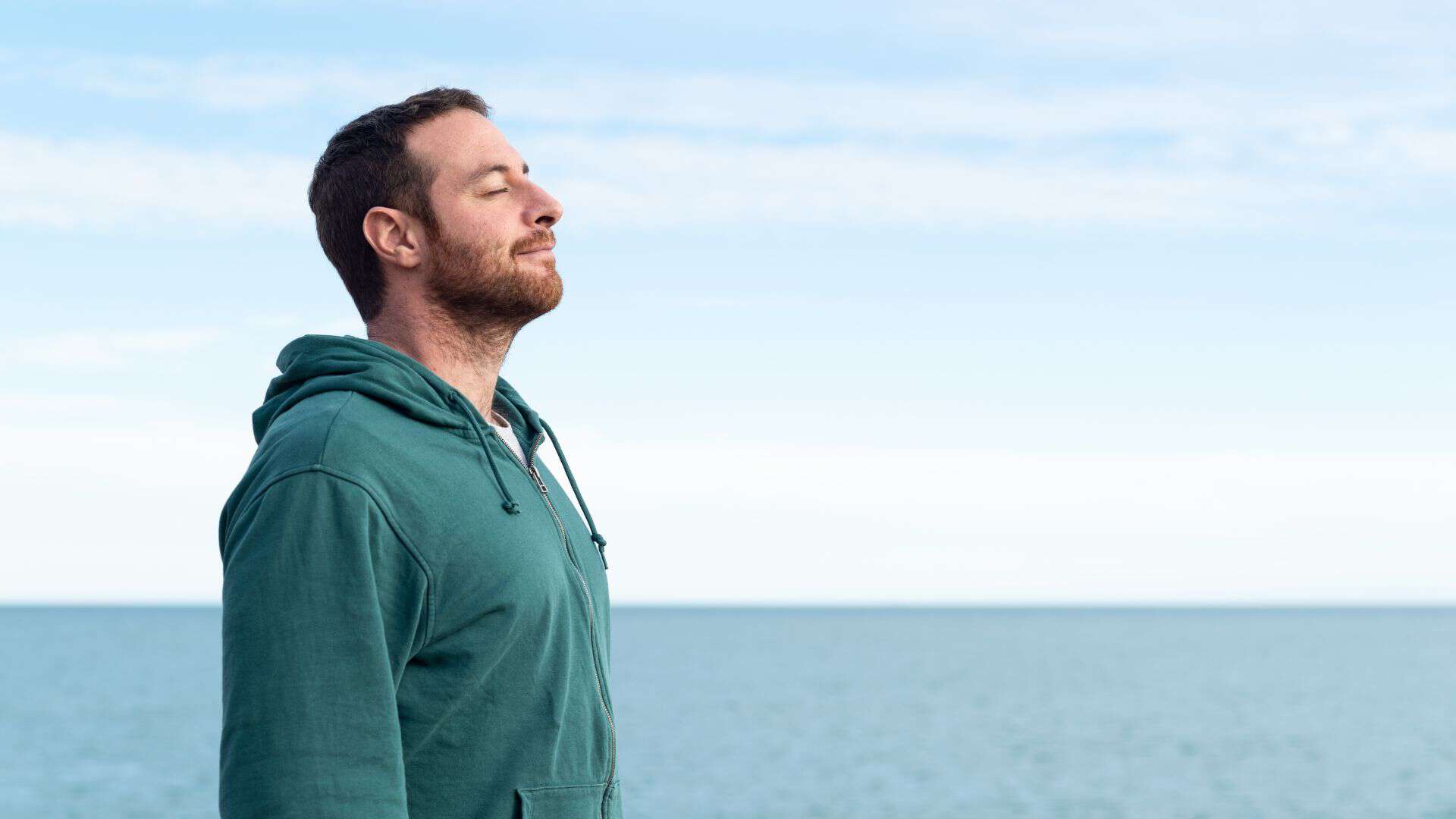 A man experiencing deep relaxation following a session of mindfulness therapy.